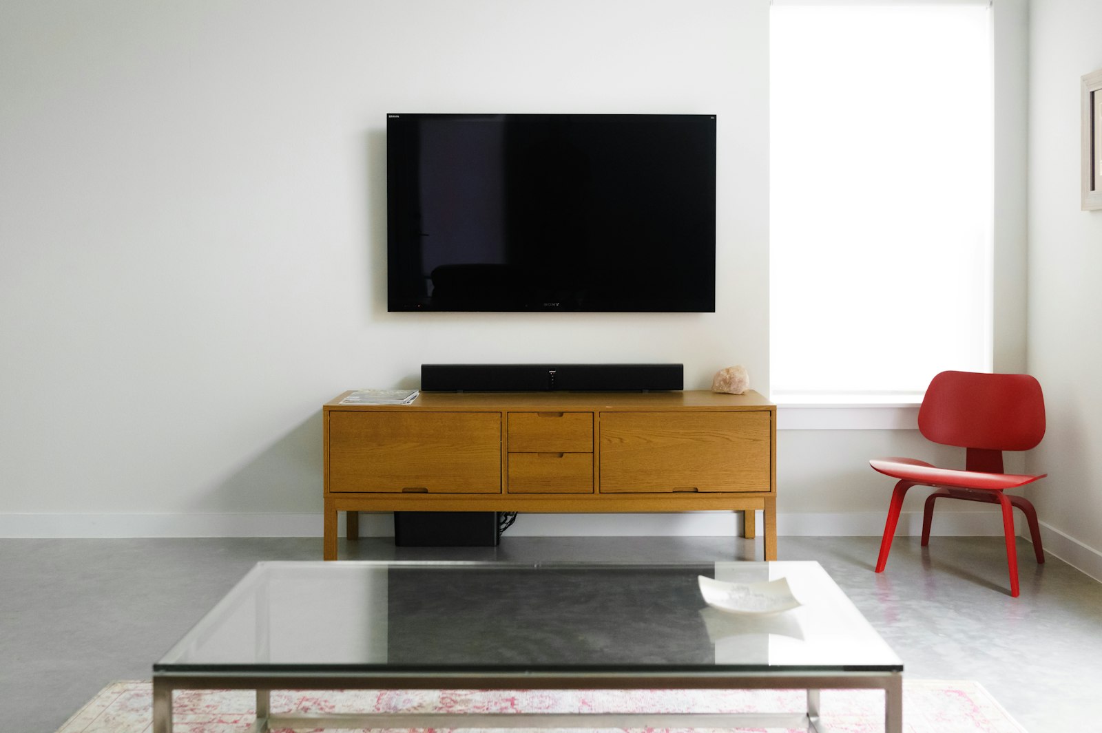 Flat-screen wall-mounted TV in a living room