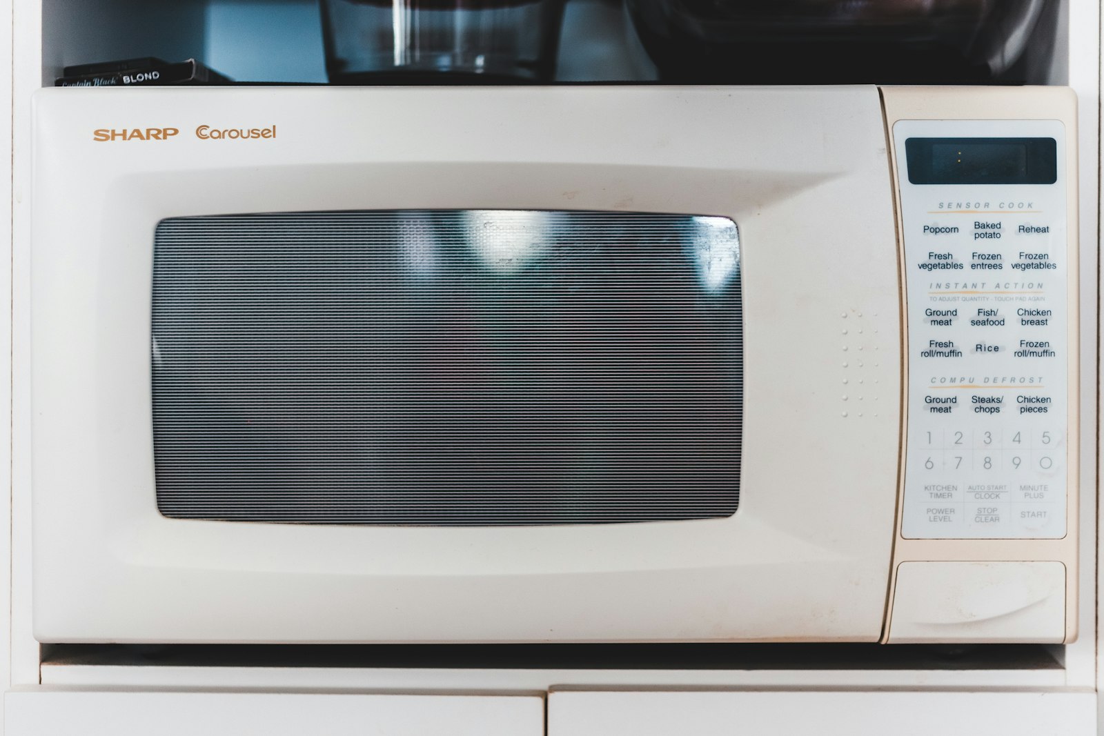White Sharp Carousel microwave oven on a counter