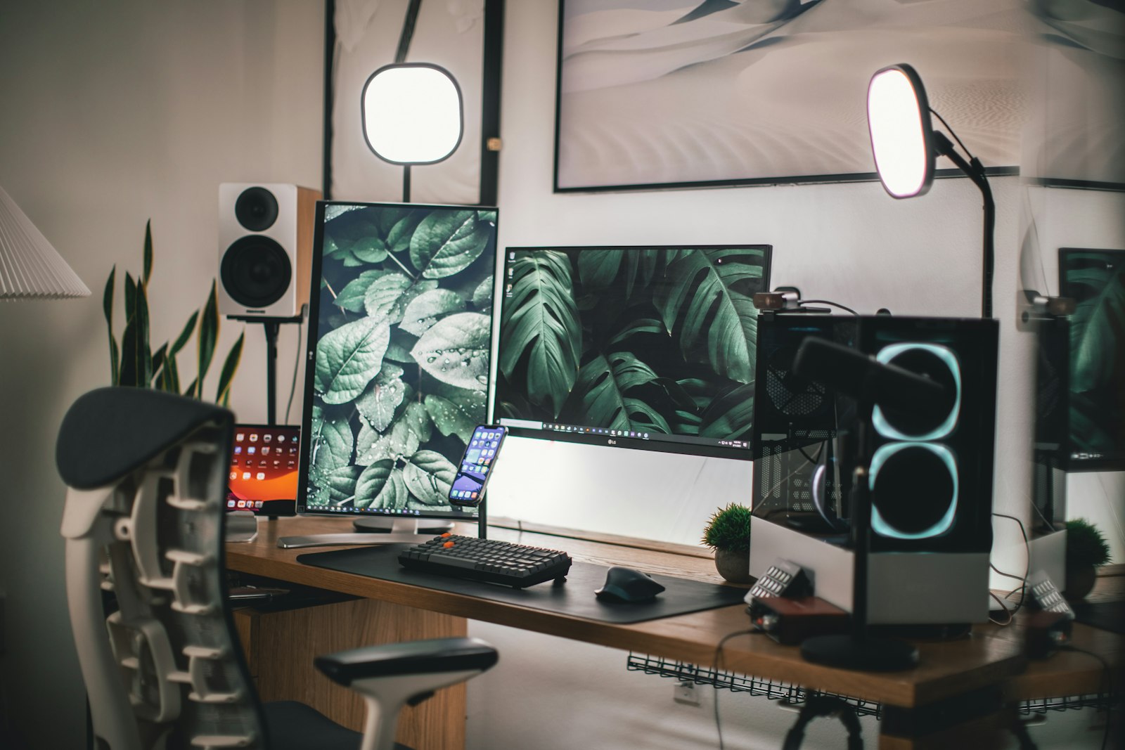 Black flat-screen computer monitor on a white wooden desk